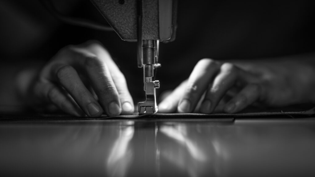 Tailor at work on sewing machine